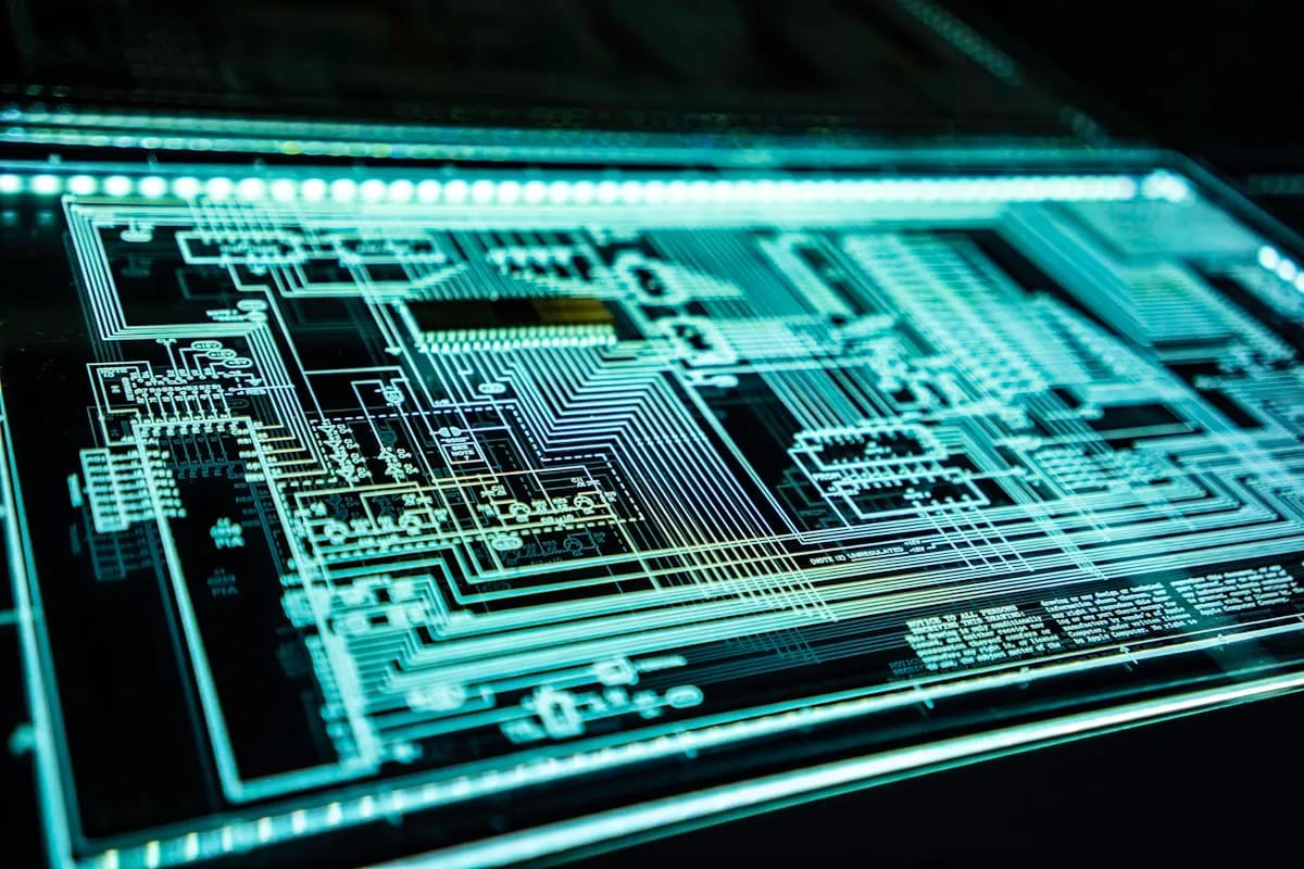 Digital shield icon over a circuit board representing the remediation patterns needed to lock down privileged CI/CD workflow execution against Cordyceps-class attacks