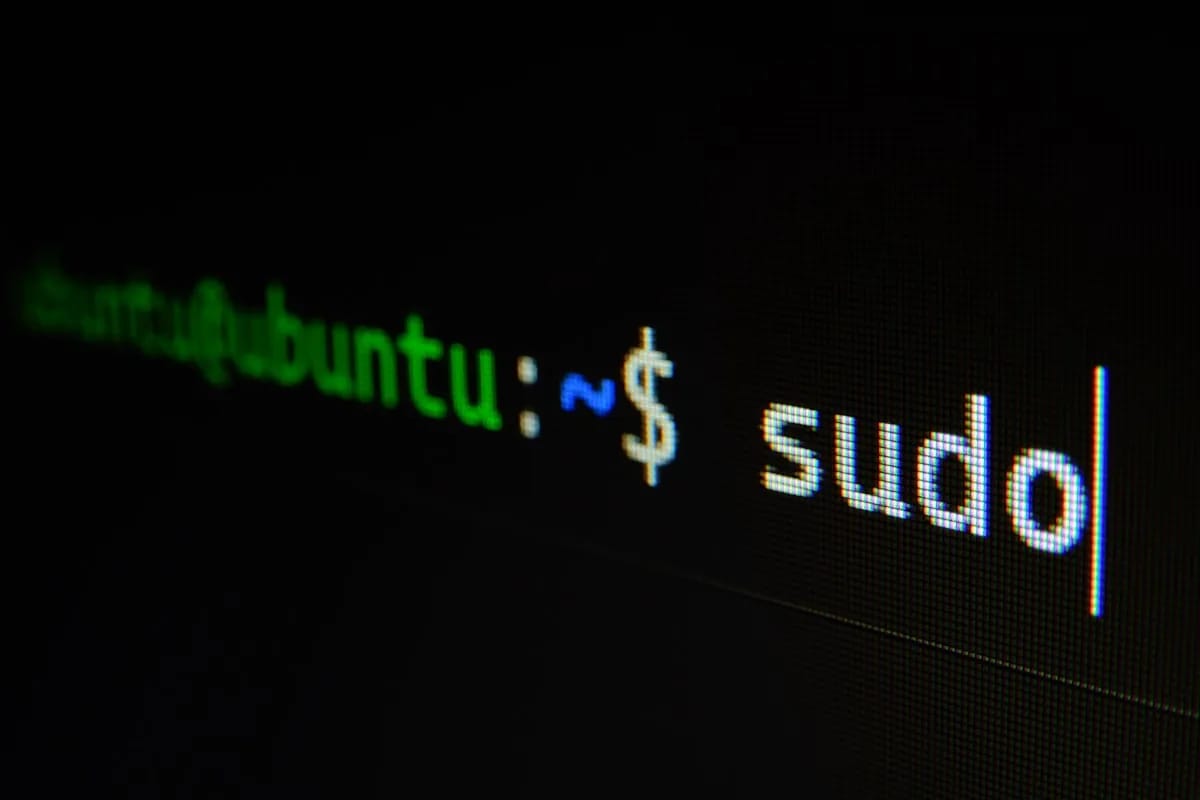 Close-up of a dark terminal with code output representing the privileged workflow execution context where pull_request_target runs YAML from the target branch with full secret access
